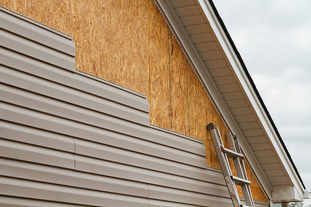 Professional Siding Contractor technician working in Westport, IN